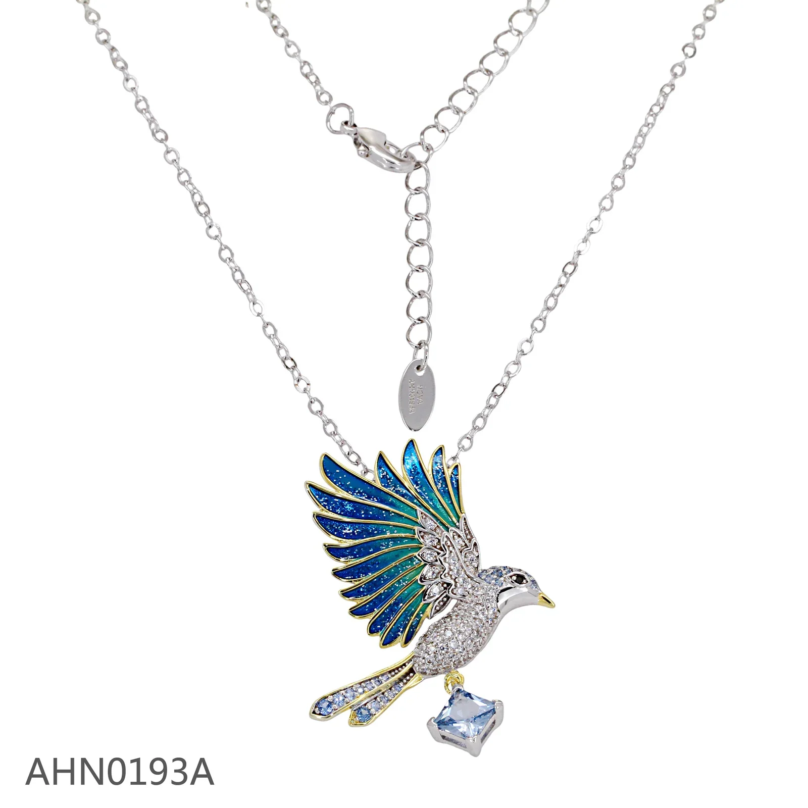 Silver-tone necklace with a blue enamel bird pendant and clear drop stone