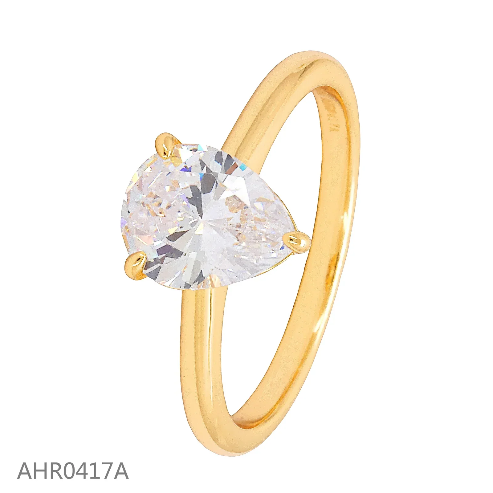 Gold-tone solitaire ring with a clear pear-shaped stone