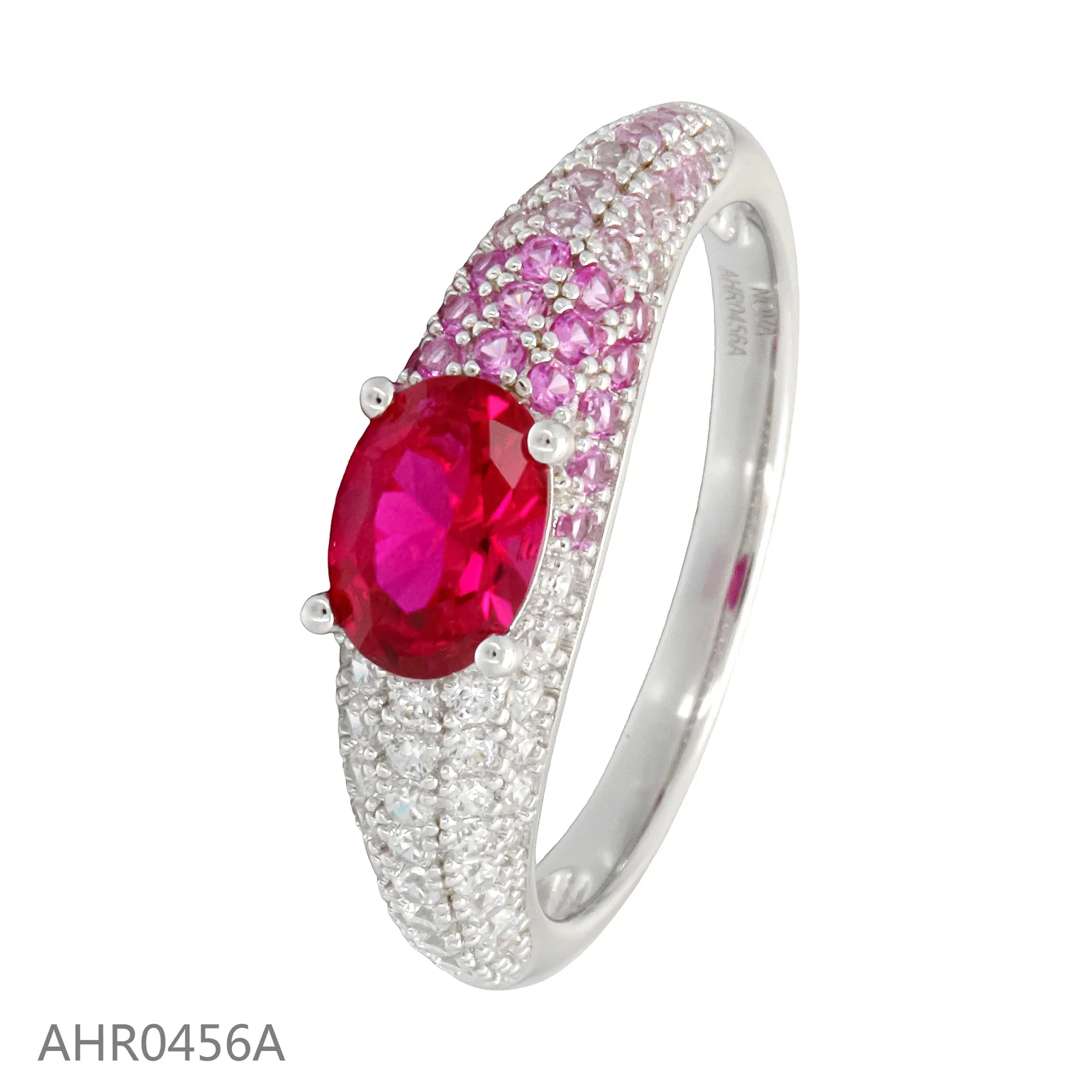 Silver-tone ring with an oval pink center stone and small clear and pink accents