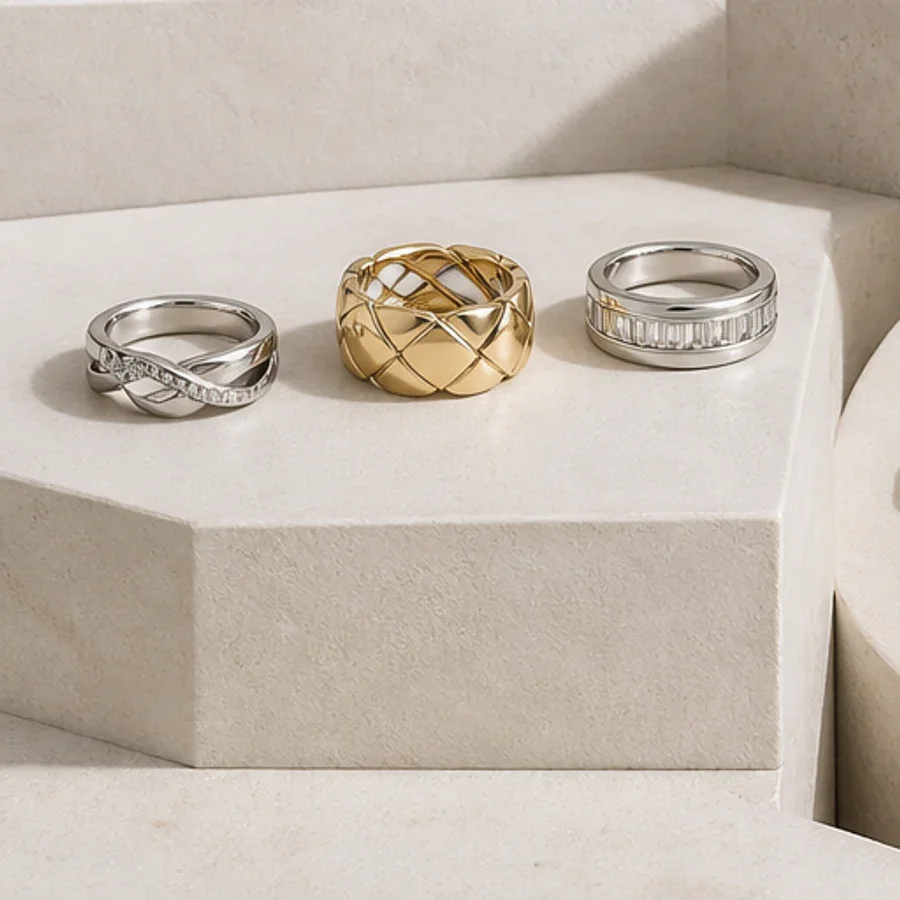 Illustrative silver-tone band rings and a gold-tone openwork ring