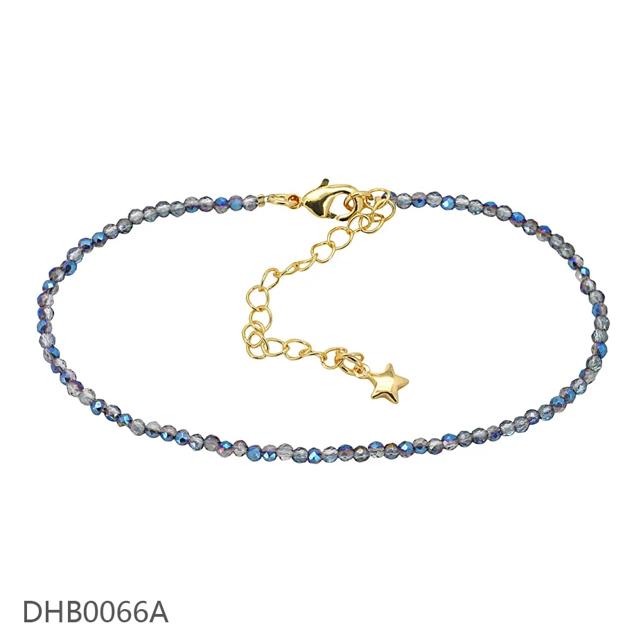 Dark blue beaded bracelet with a gold-tone extension chain and star charm