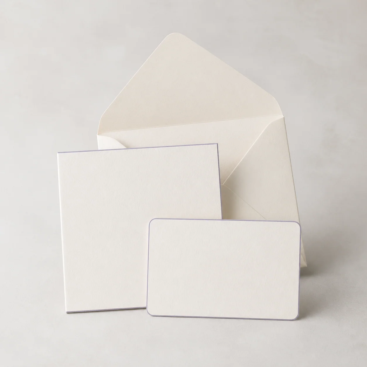 Blank ivory care cards and envelope with gray-lavender edges