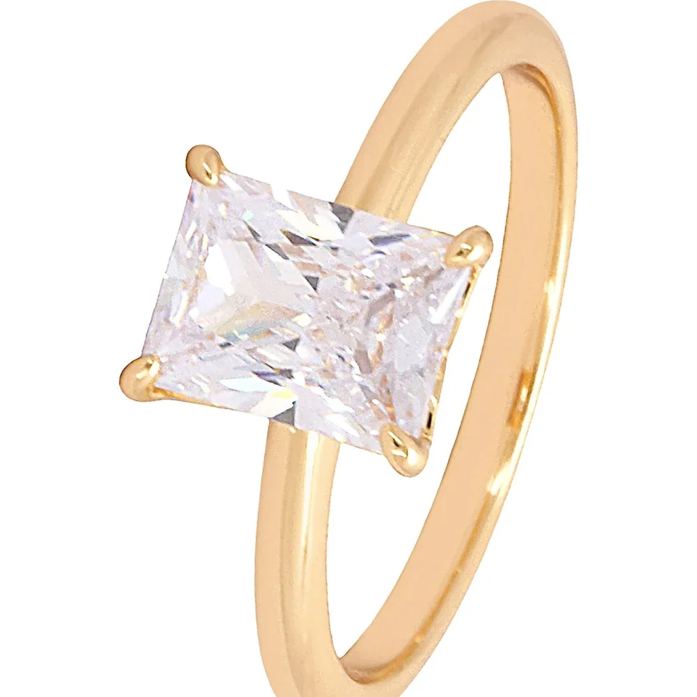 Gold-tone solitaire ring with a square clear stone in a four-prong setting