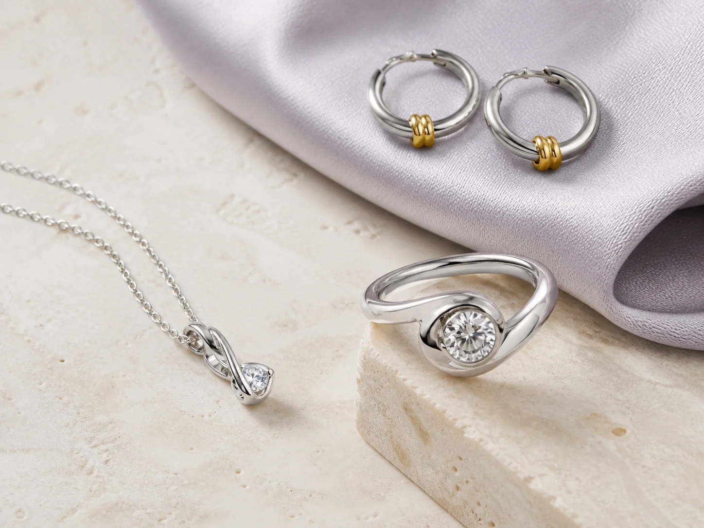 A refined selection of silver and gold-accent jewelry representing NOVA's development-to-production support