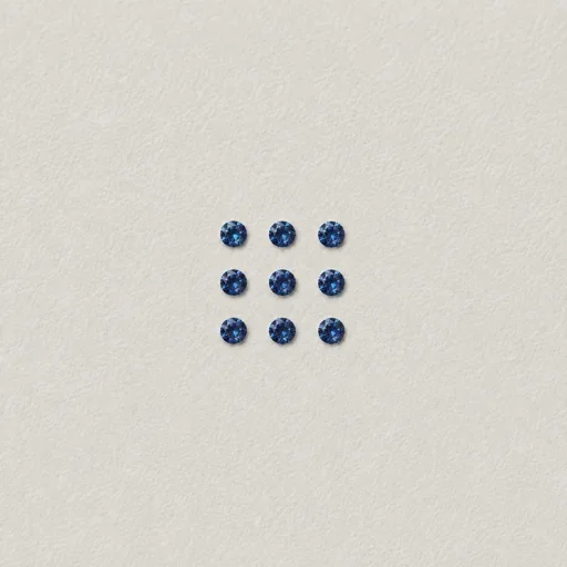 Illustrative group of nine small blue loose stones representing melee accents