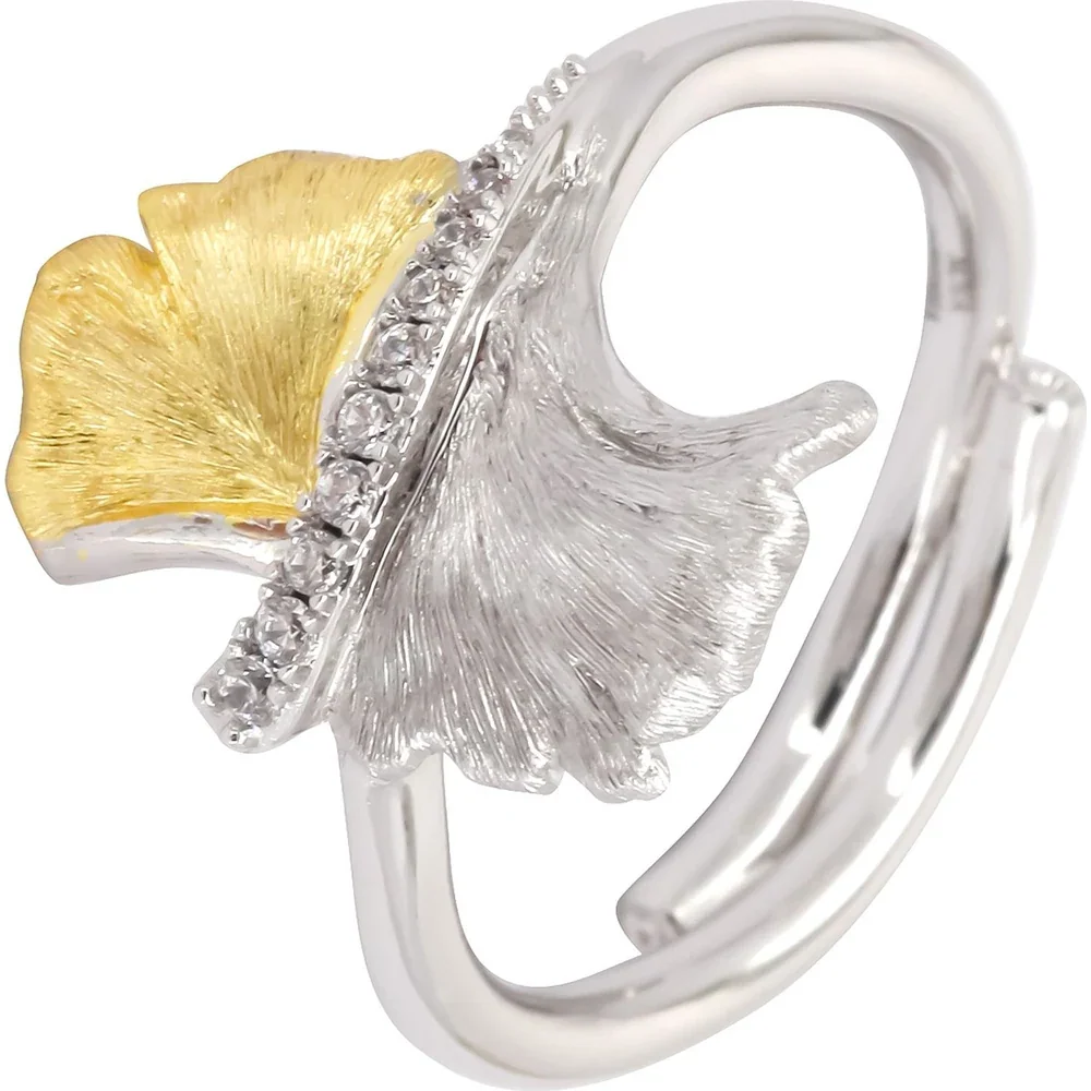 Two-tone ginkgo leaf ring with textured metal surfaces and clear stone accents