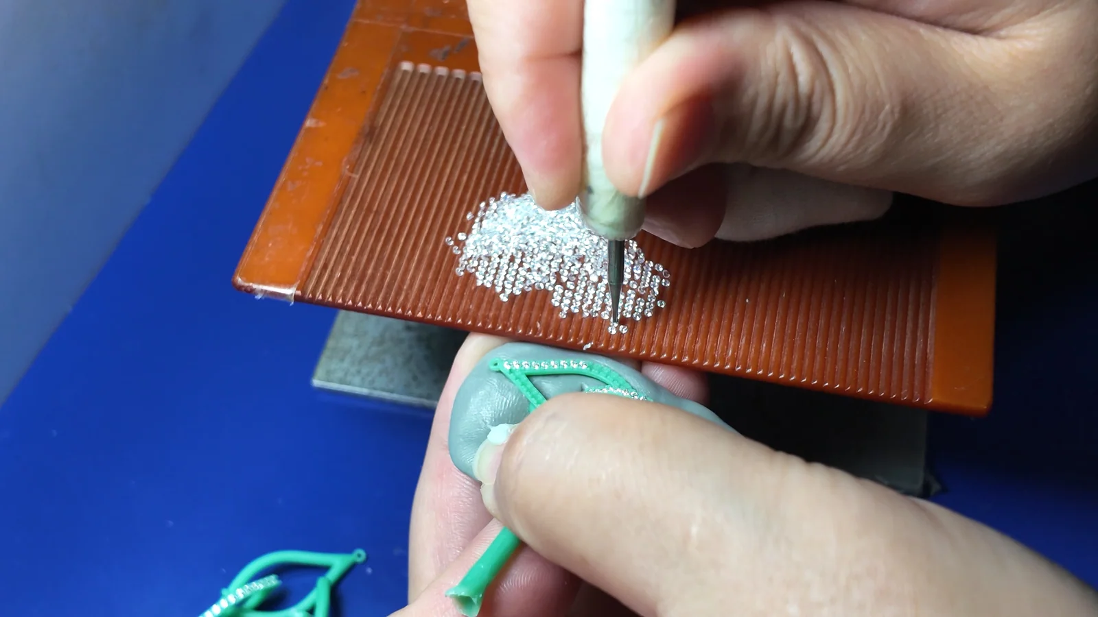 Stones being arranged for a jewelry production stage